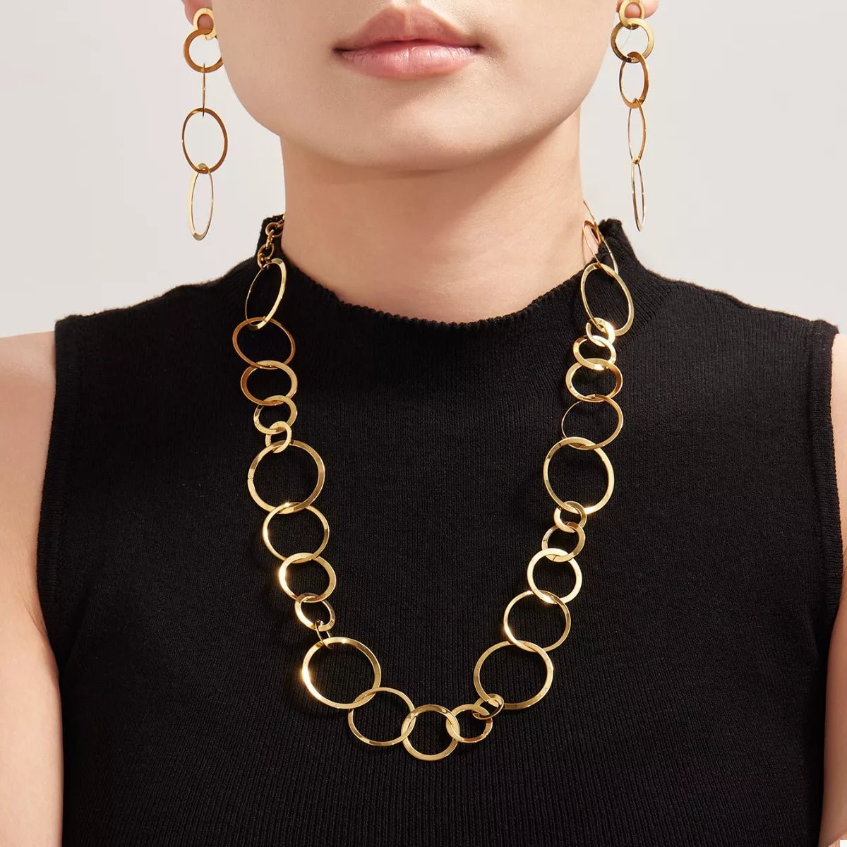 Front view of 18K Gold-Plated Chain Link Necklace in Gold showing neckline and sleeve details