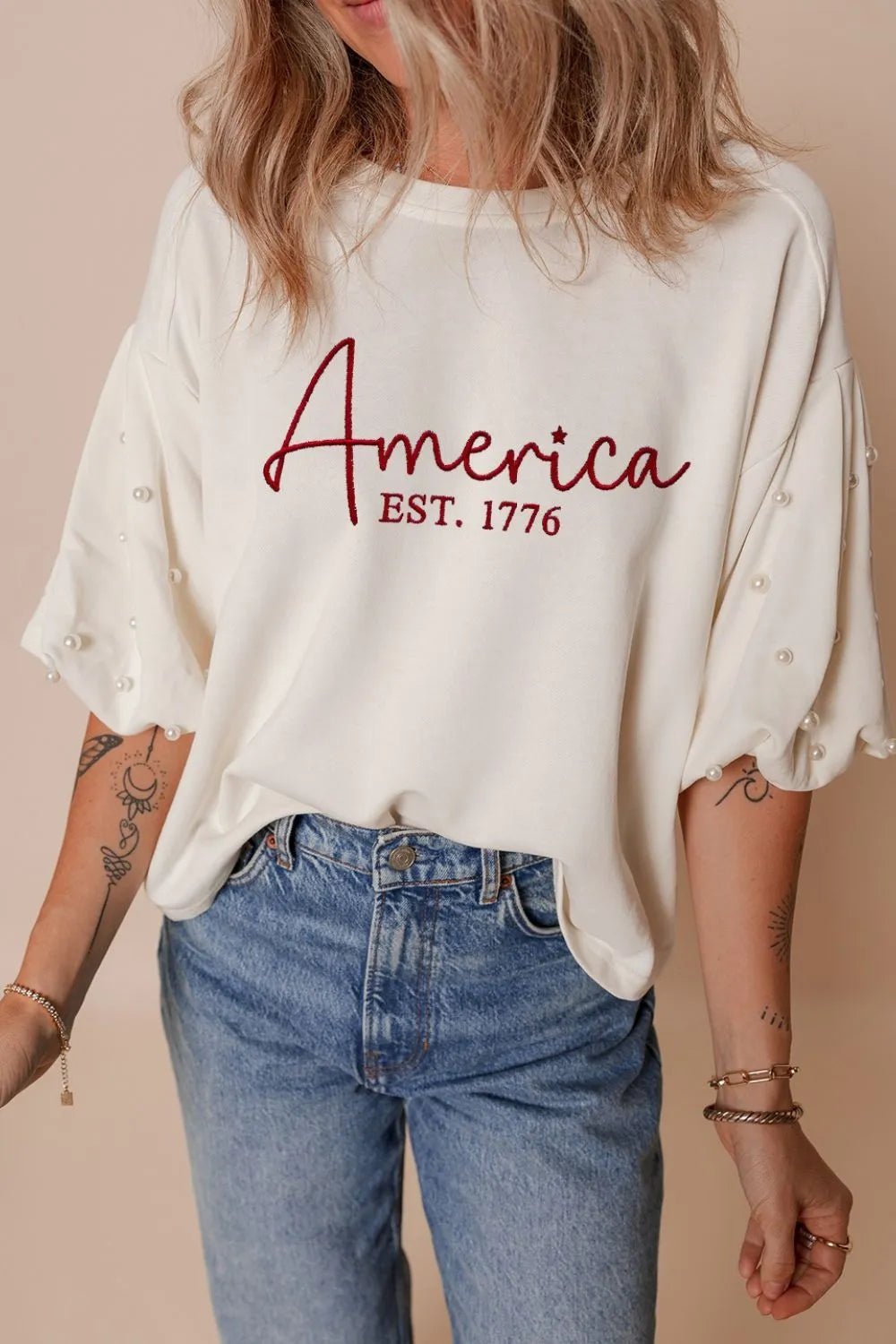 Front view of AMERICA Embroidered Pearl Beaded Sleeve T ShirtST 1776 E in White showing neckline and sleeve details
