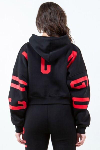 Front view of American Bazi Letter Graphic Long Sleeve Drawstring Cropped Hoodie in Black showing neckline and sleeve details