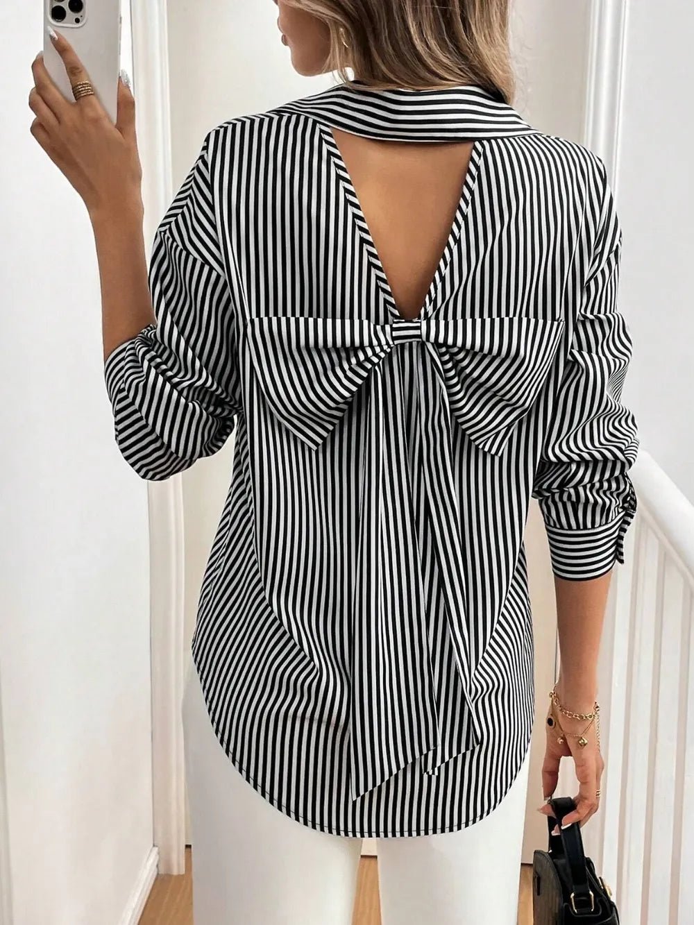 Front view of Cutout Bow Back Striped Collared Neck Long Sleeve Shirt in Black showing neckline and sleeve details