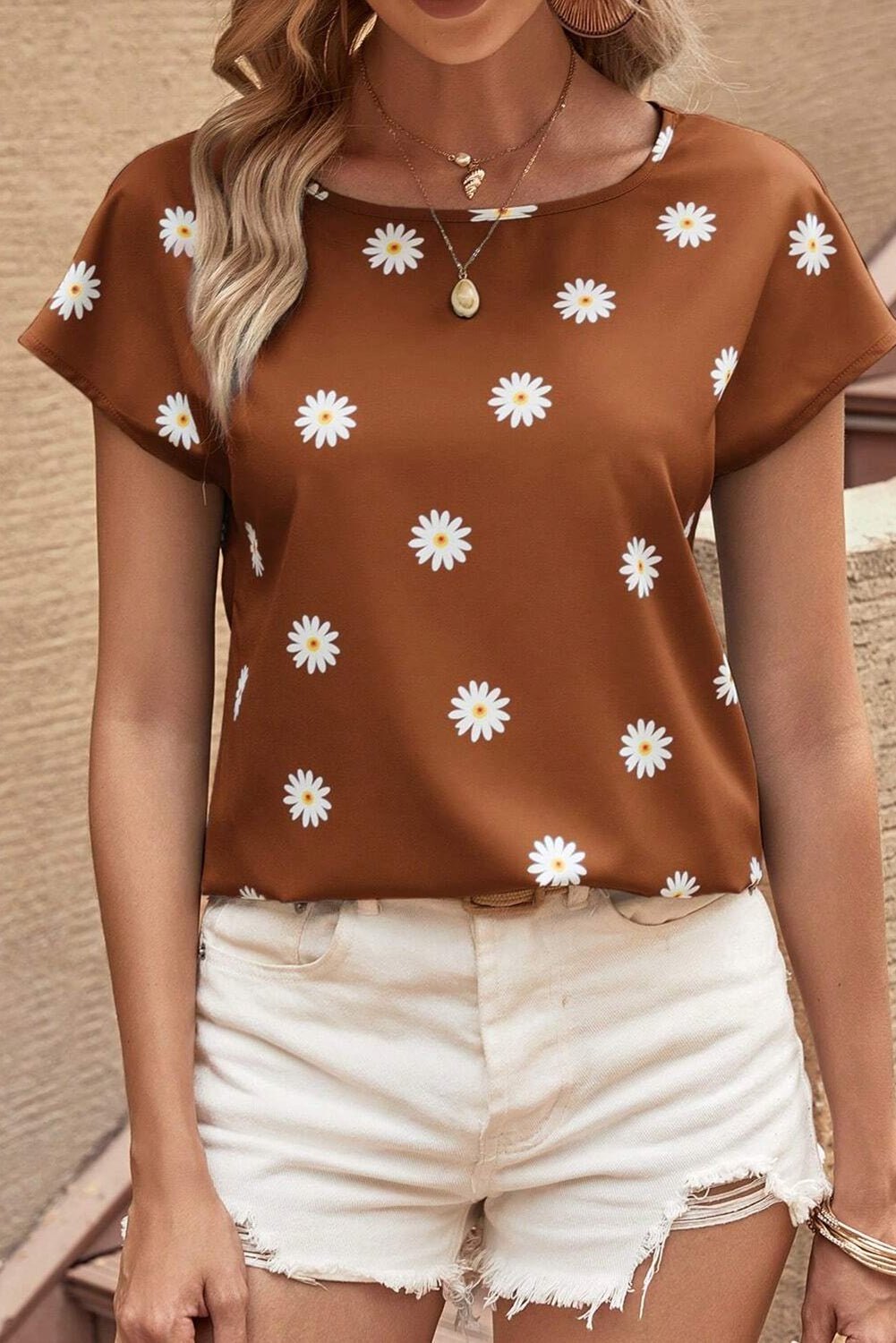 Front view of Daisy Printed Round Neck Short Sleeve Blouse in Caramel showing neckline and sleeve details (97% polyester and)