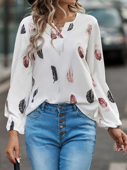 Front view of Feather Print Notched Balloon Sleeve Top in White showing neckline and sleeve details