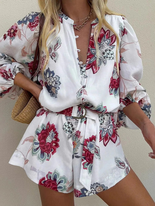 Front view of Floral Print Long Sleeve Romper in White showing neckline and sleeve details (100% polyester Care Instructions)