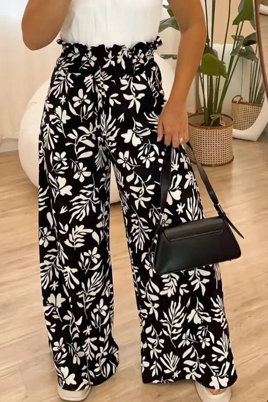 Front view of Full Size Printed High Waist Wide Leg Pants in Black showing neckline and sleeve details (100% polyester)