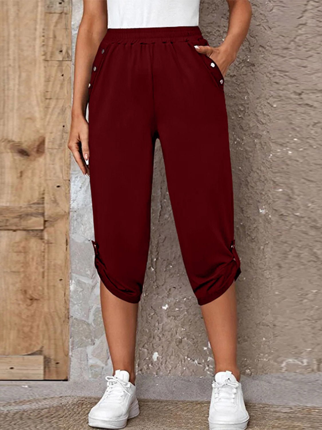 Front view of Full Size Roll-Tab Capris Pants in Burgundy showing neckline and sleeve details (100% polyester)