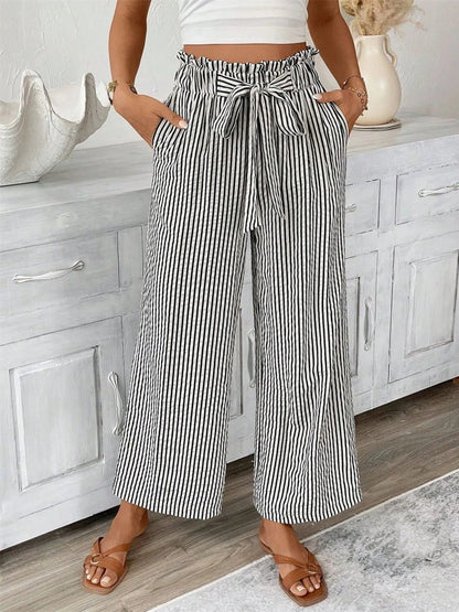 Front view of Full Size Striped Wide Leg Paper Bag Pants Plus Size in Black showing neckline and sleeve details