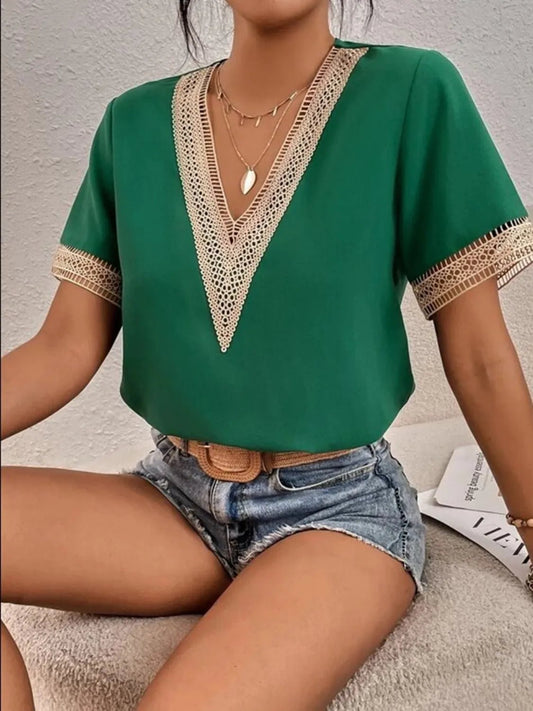 Front view of Full Size V-Neck Short Sleeve Blouse Plus Size in Dark Green showing neckline and sleeve details