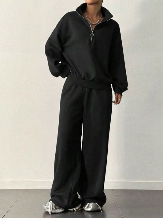 Front view of Half-Zip Long Sleeve Sweatshirt and Pants Set in Black showing neckline and sleeve details