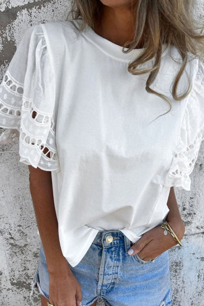 Front view of Hollow Out Embroidered Short Sleeve Round Neck Top in White showing neckline and sleeve details