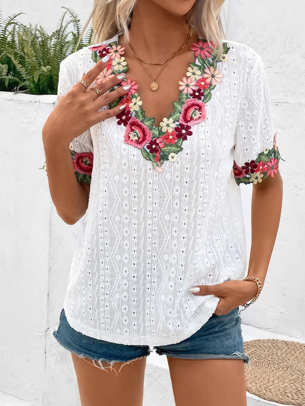 Front view of Ivy Lane Eyelet Embroidered V-Neck Short Sleeve Blouse in White showing neckline and sleeve details