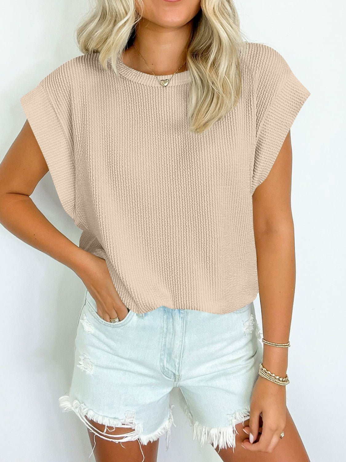 Front view of Lovelet Textured Round Neck Cap Sleeve Blouse in Beige showing neckline and sleeve details