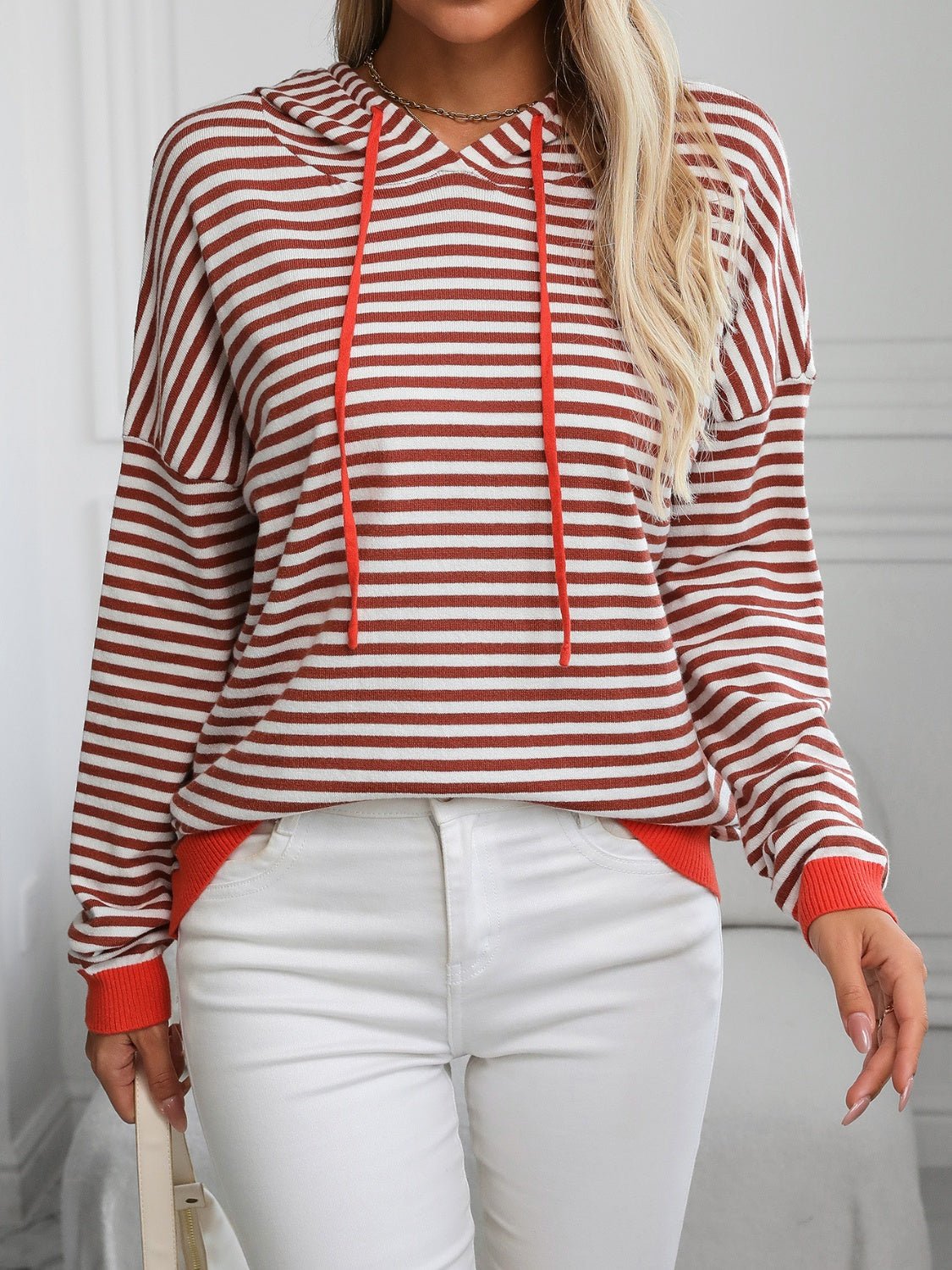 Front view of Mandy Striped Long Sleeve Hooded Knit Top in Dark Brown showing neckline and sleeve details
