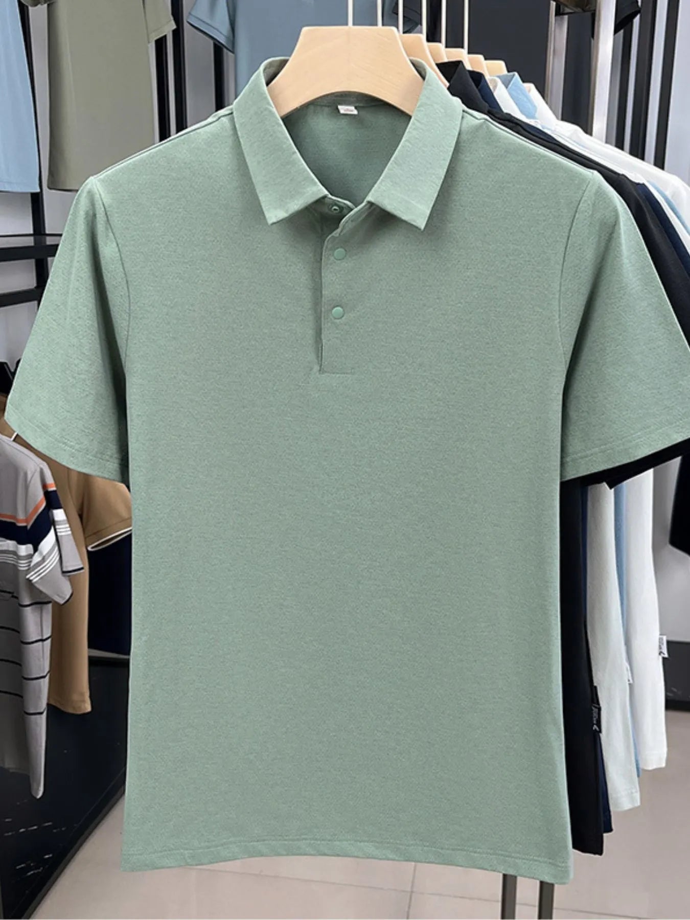 Front view of Men's Plus Size Button Detail Short Sleeve Polo in Black showing neckline and sleeve details