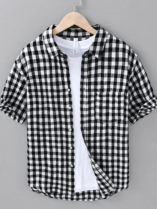 Front view of Men's Plus Size Plaid Button Up Short Sleeve Shirt in Black showing neckline and sleeve details