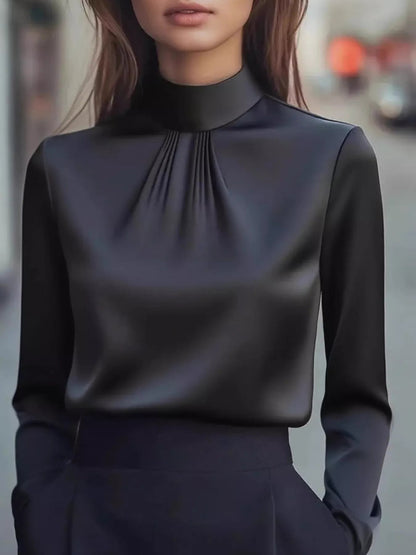 Front view of Mock Neck Long Sleeve Blouse with Pleated Detail in Black showing neckline and sleeve details
