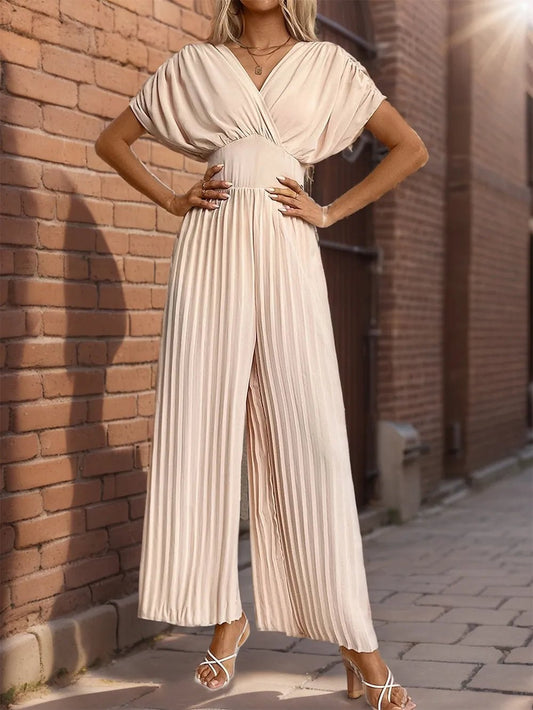 Front view of Perfee Pleated Short Sleeve Wide Leg Jumpsuit in Apricot showing neckline and sleeve details (100% polyester)