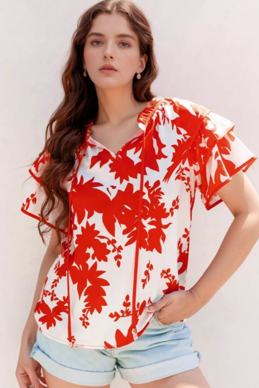 Front view of Plant Print Tiered Ruffled Sleeve Tie Neck Blouse in Red showing neckline and sleeve details