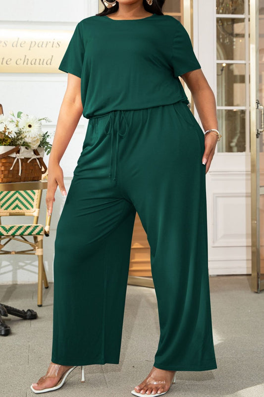 Front view of Plus Size Drawstring Waist Short Sleeve Jumpsuit in Forest showing neckline and sleeve details (95% rayon and)