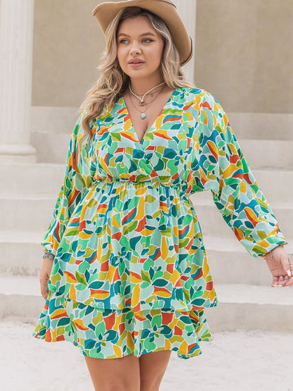 Front view of Plus Size Printed Surplice Long Sleeve Mini Dress in Green showing neckline and sleeve details