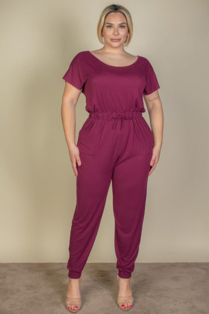Front view of Plus Size Solid Drawstring Short Sleeve Jumpsuit showing neckline and sleeve details