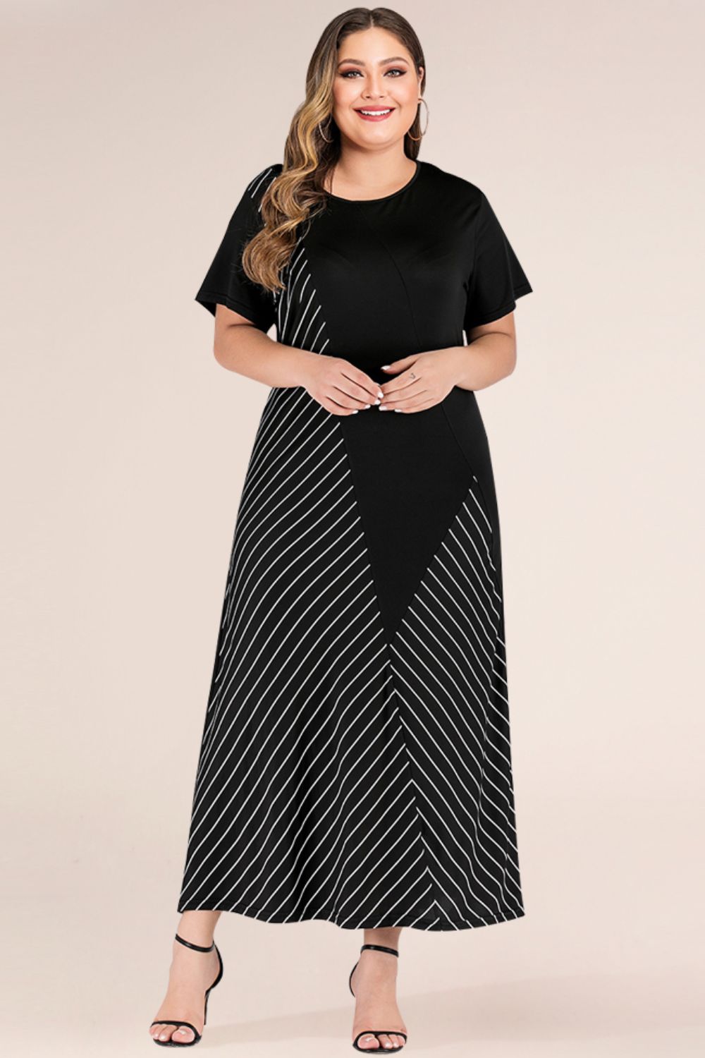 Front view of Plus Size Striped Color Block Tee Dress in Black showing neckline and sleeve details