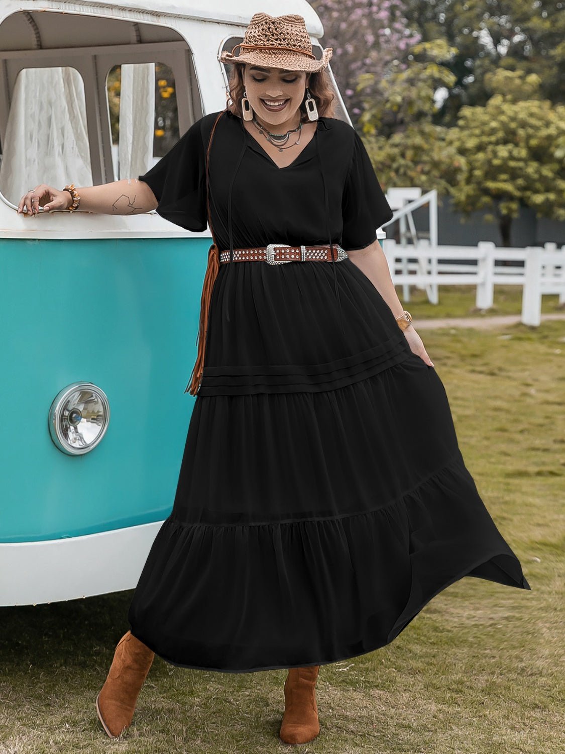 Front view of Plus Size Tie Neck Flutter Sleeve Dress in Black showing neckline and sleeve details