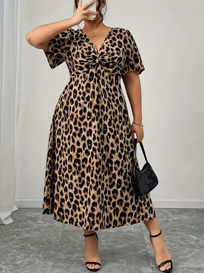 Front view of Plus Size Twisted Front Leopard Short Sleeve Dress in Leopard showing neckline and sleeve details