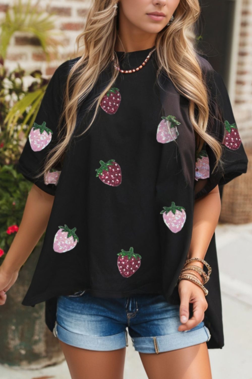 Front view of Sequin Strawberry High Low Half Sleeve Relaxed Fit T-Shirt in Black showing neckline and sleeve details