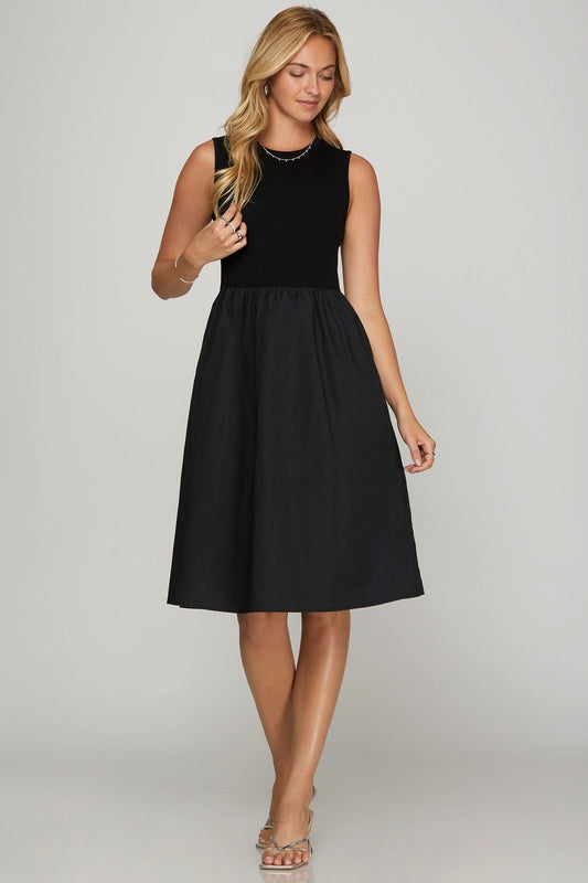 Front view of She + Sky Full Size Sleeveless Poplin Woven Midi Dress with Pockets Plus Size in Black showing neckline and sle