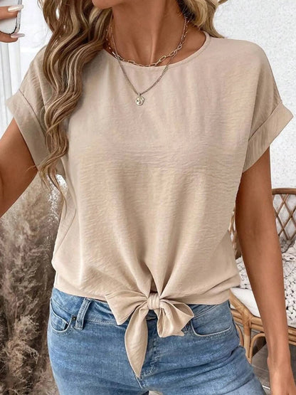 Front view of Solid Color Knotted Hem Short Sleeve Blouse in Beige showing neckline and sleeve details