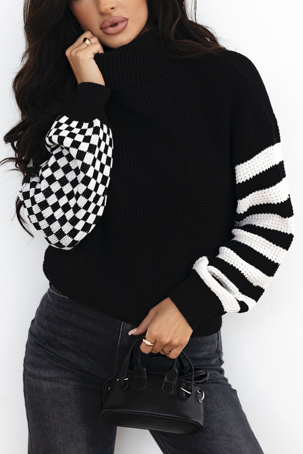 Front view of Striped & Checkered Turtleneck Dropped Shoulder Sweater in Black showing neckline and sleeve details