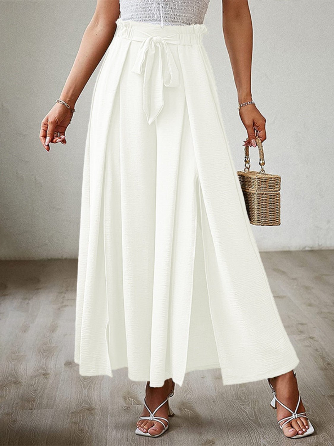 Front view of Tied Slit Wide Leg Pants in White showing neckline and sleeve details (100% polyester Care Instructions)