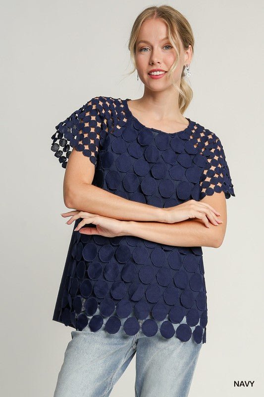 Front view of Umgee Full Size Mixed Polka Dot Lace Raglan Sleeve Boxy Cut Top Plus Size in Dark Blue showing neckline and sle