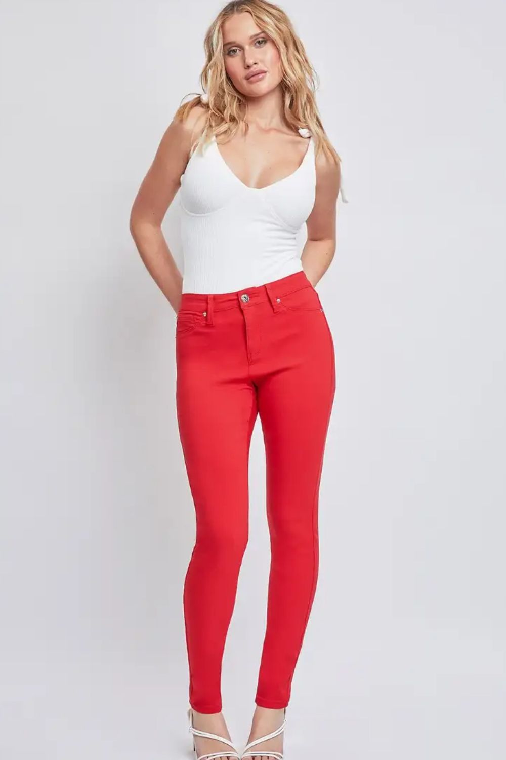 Front view of YMI Jeanswear Full Size Hyperstretch Mid-Rise Skinny Jeans in Ruby Red showing neckline and sleeve details